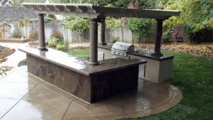 outdoor kitchen with pergola